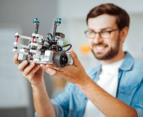 Man holding a futuristic gadget